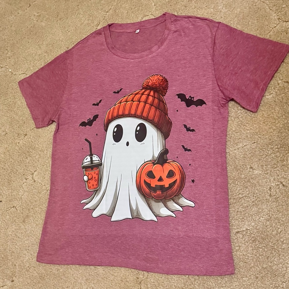 Ghost with Orange knit Hat tee shirt on rose colored tee shirt